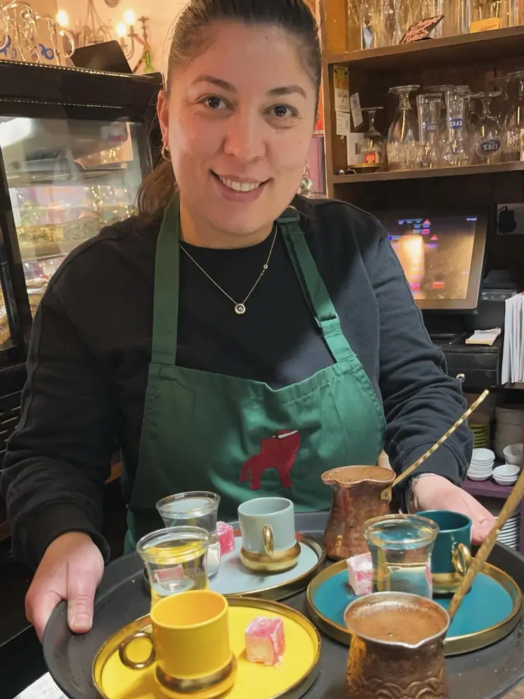 Turkish coffee served on trays with copper cezve and Turkish delight